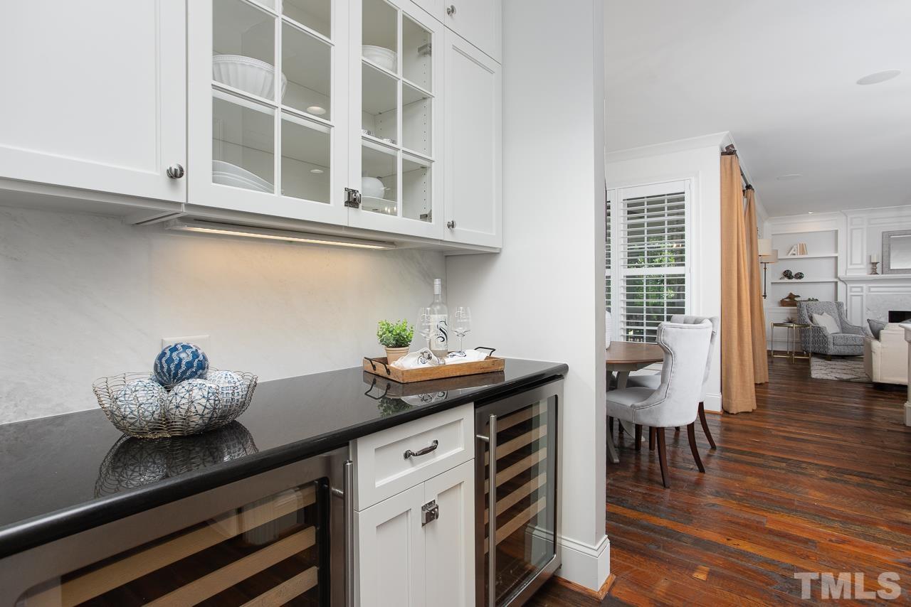 902 Shelley Road Raleigh, NC 27609 - Photo 15 of 45 a kitchen with granite countertop a stove and cabinets