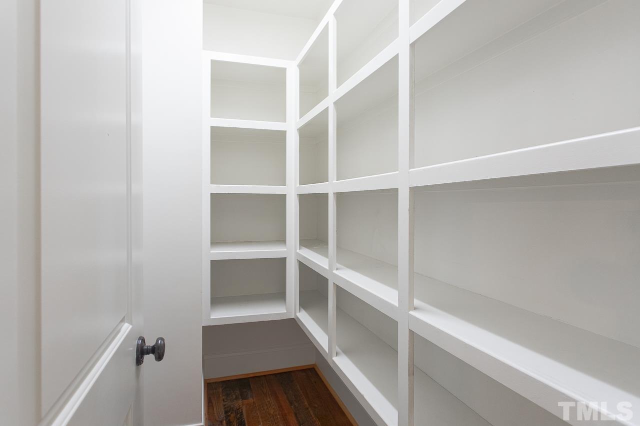 902 Shelley Road Raleigh, NC 27609 - Photo 16 of 45 a view of walk in closet with empty racks