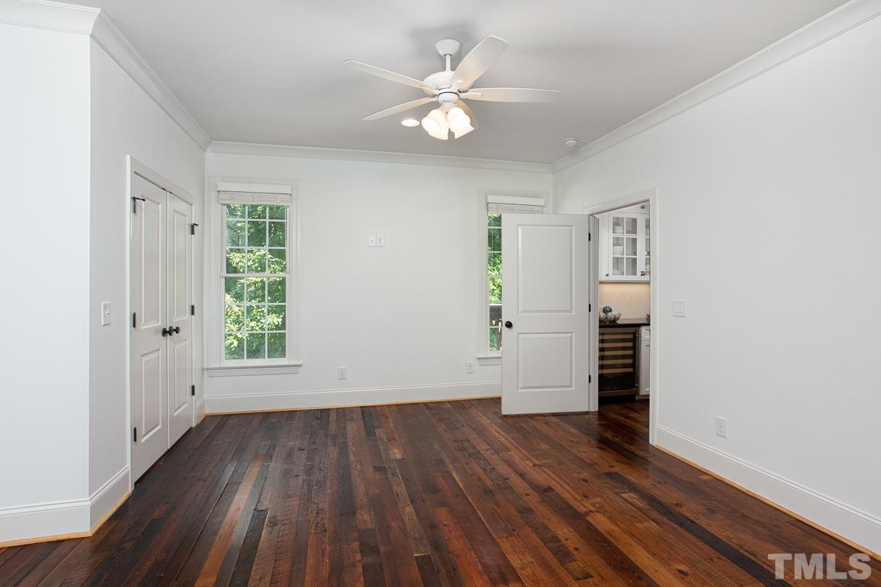 902 Shelley Road Raleigh, NC 27609 - Photo 17 of 45 wooden floor in an empty room with a window