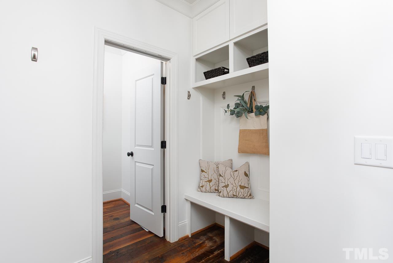 902 Shelley Road Raleigh, NC 27609 - Photo 20 of 45 a view of hallway with wooden floor