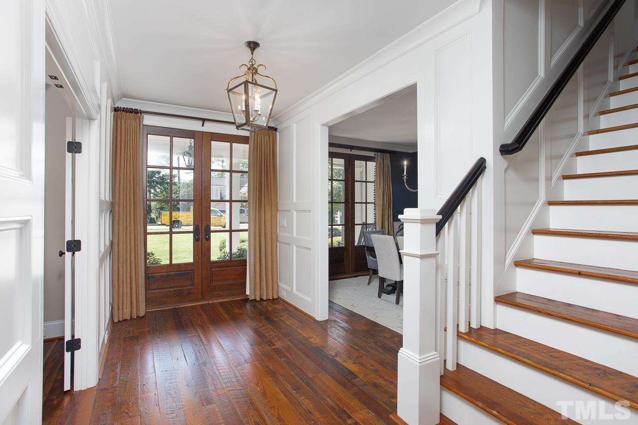 902 Shelley Road Raleigh, NC 27609 - Photo 21 of 45 a view of entryway with wooden floor and stairs