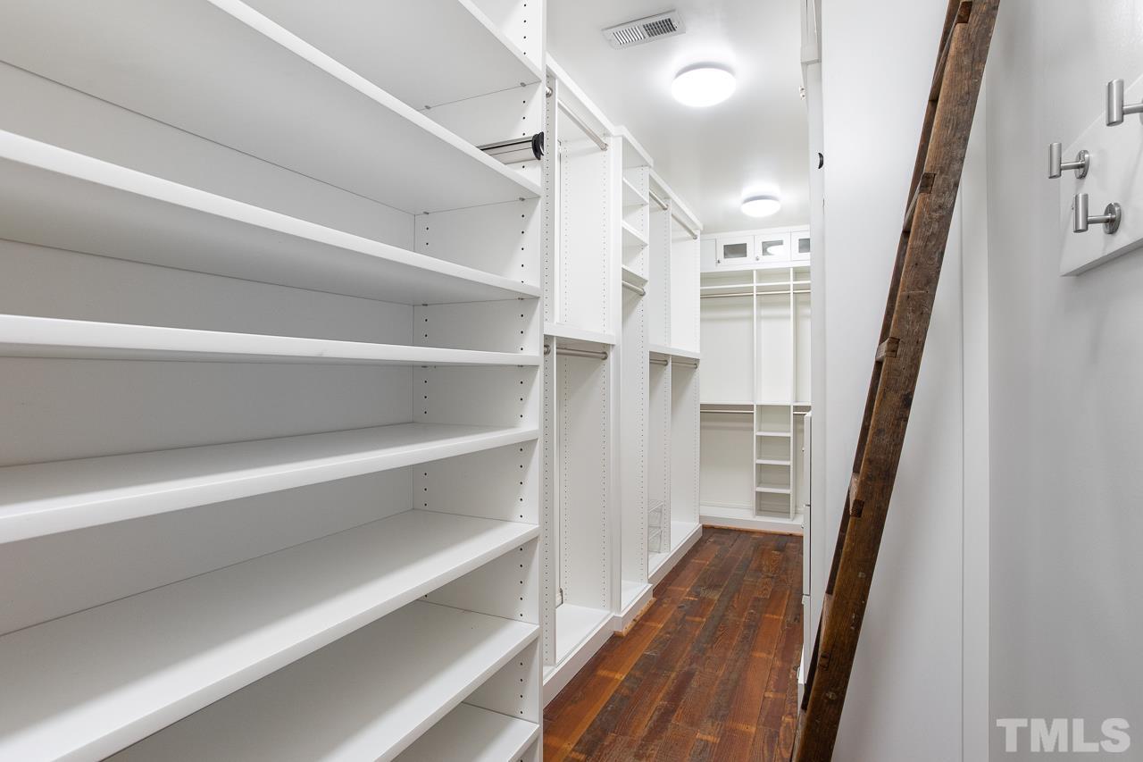 902 Shelley Road Raleigh, NC 27609 - Photo 24 of 45 a view of entryway with wooden floor and stairs