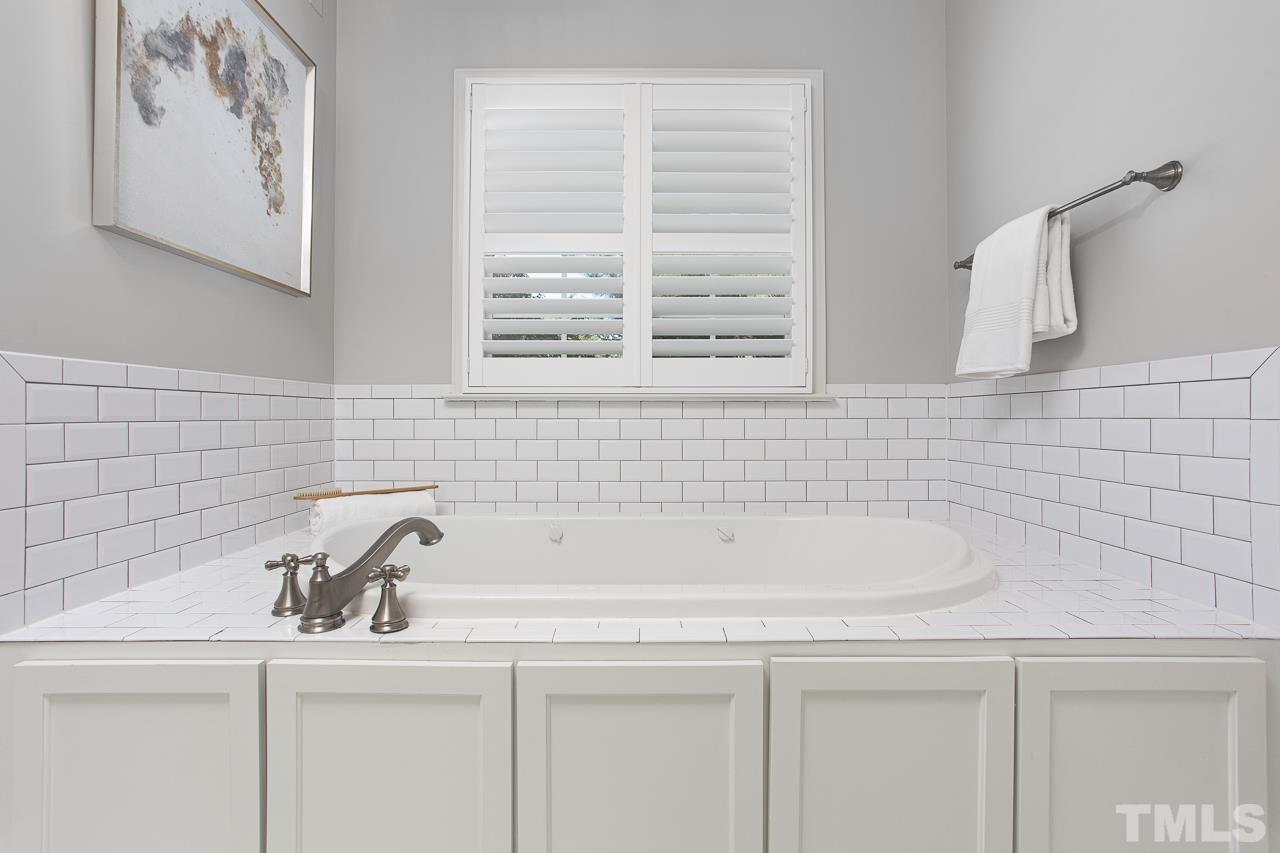 902 Shelley Road Raleigh, NC 27609 - Photo 28 of 45 a bathroom with a sink and a bathtub