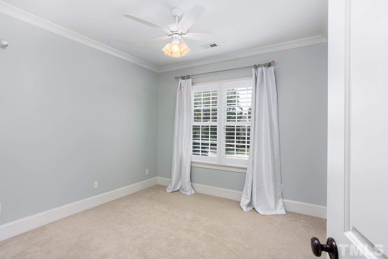 902 Shelley Road Raleigh, NC 27609 - Photo 29 of 45 an empty room with a window