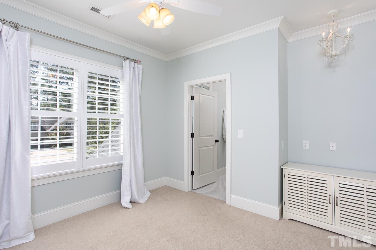 902 Shelley Road Raleigh, NC 27609 - Photo 30 of 45 a view of an empty room with a window
