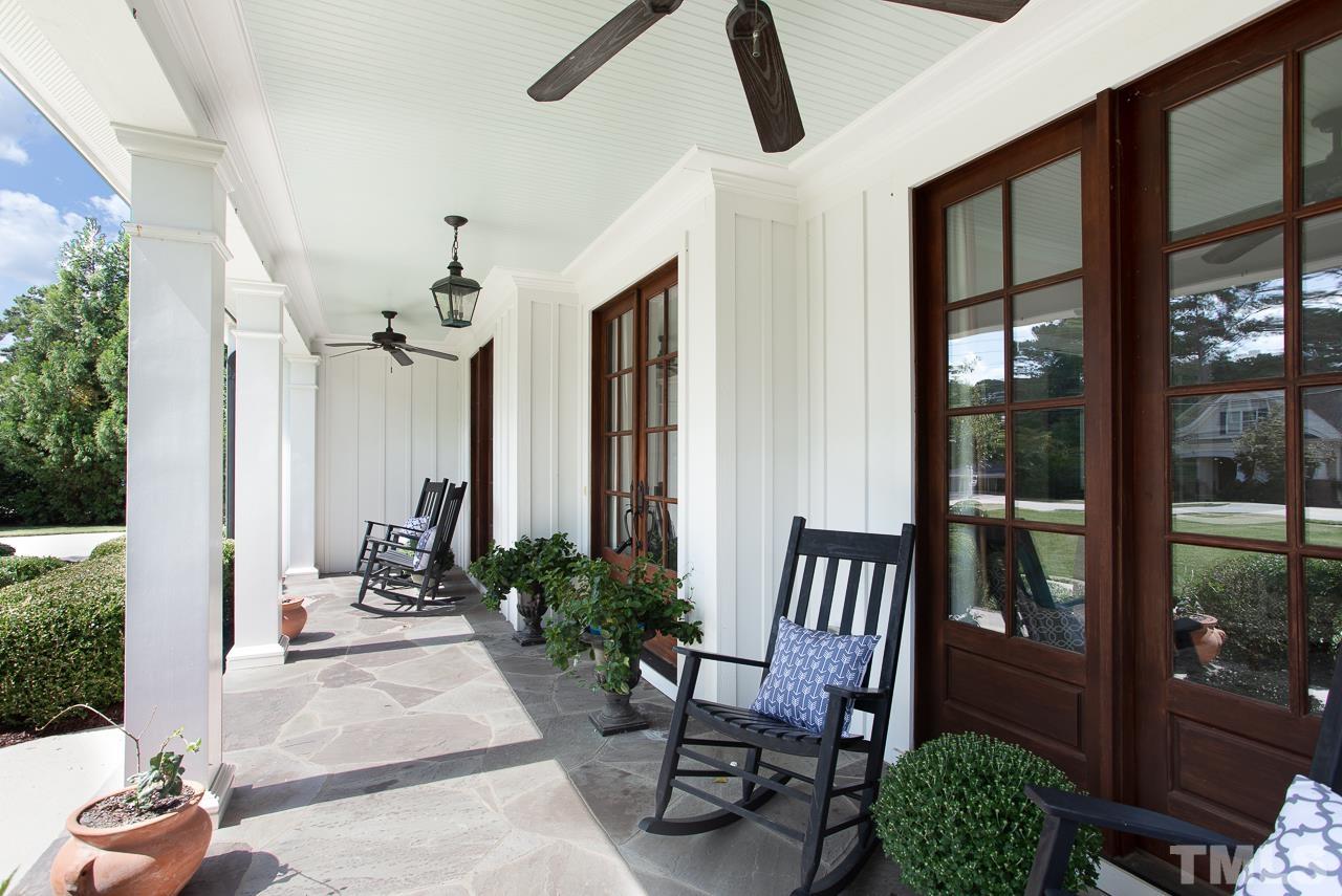 902 Shelley Road Raleigh, NC 27609 - Photo 3 of 45 a view of a balcony with chair and tables