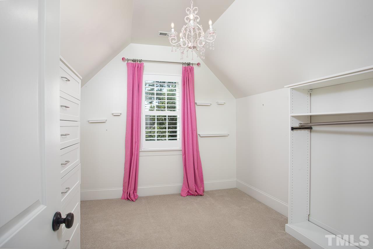 902 Shelley Road Raleigh, NC 27609 - Photo 32 of 45 a view of a room with air conditioner and a living room