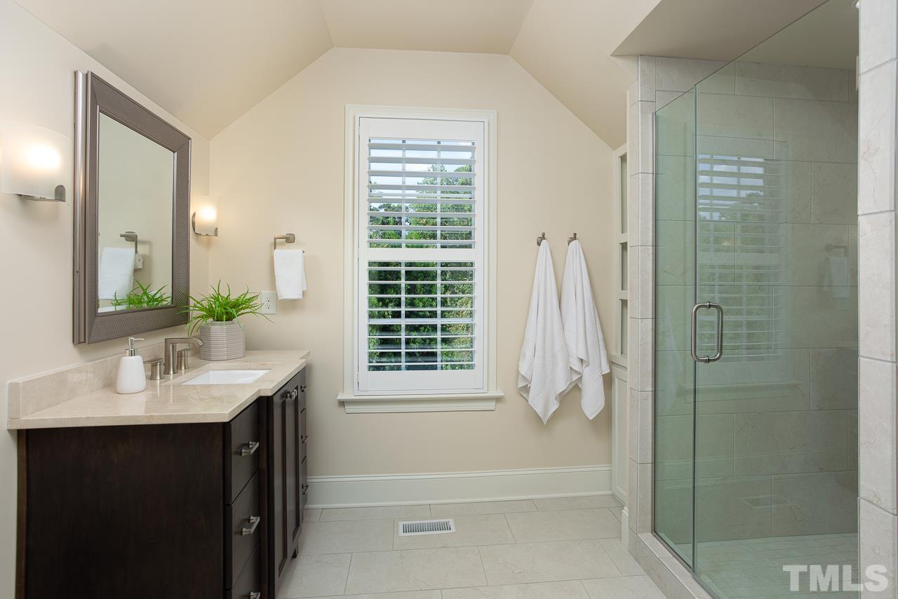 902 Shelley Road Raleigh, NC 27609 - Photo 39 of 45 a bathroom with a sink a toilet and shower