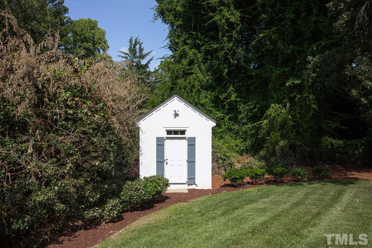 902 Shelley Road Raleigh, NC 27609 - Photo 42 of 45 a house with trees in the background