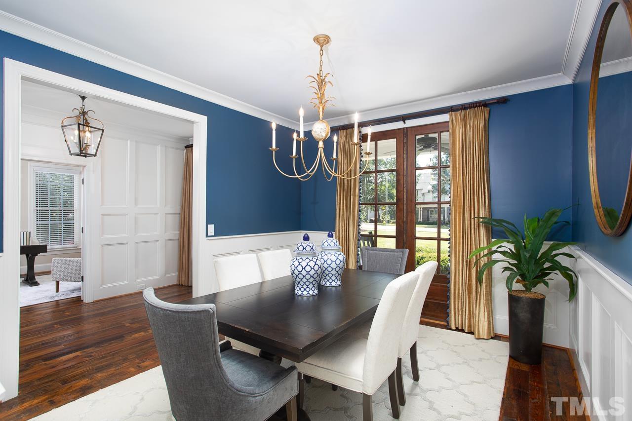902 Shelley Road Raleigh, NC 27609 - Photo 5 of 45 a view of a dining room with furniture window and wooden floor