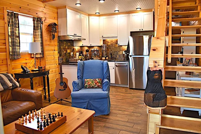 a view of a livingroom with furniture and a flat screen tv