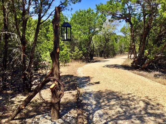 a view of a snow in between the trees