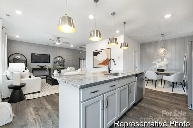 a large kitchen with lots of counter space and a sink