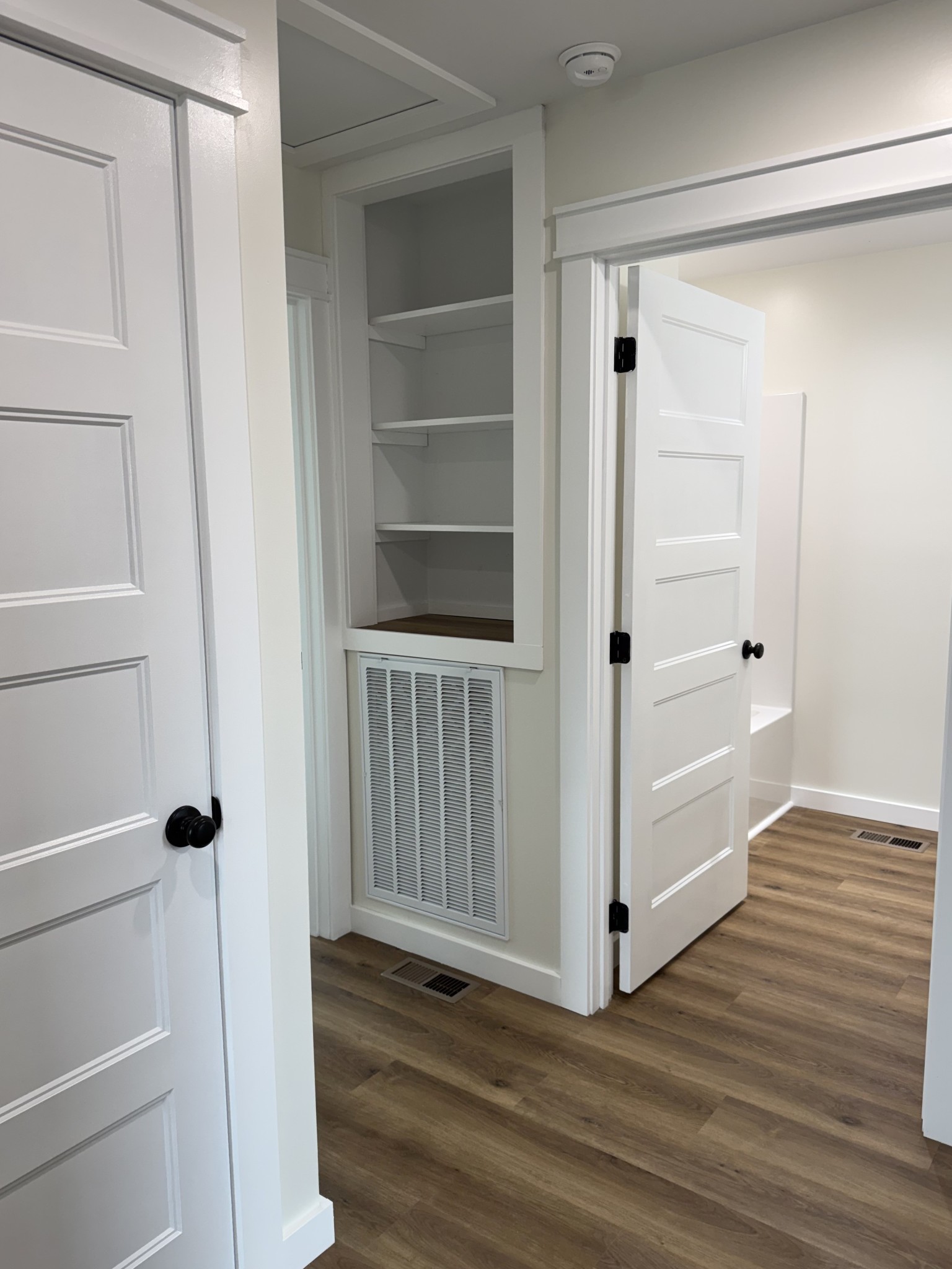 706 Courthouse View Street Lafayette, TN 37083 - Photo 11 of 27 a view of a hallway with wooden floor and closet