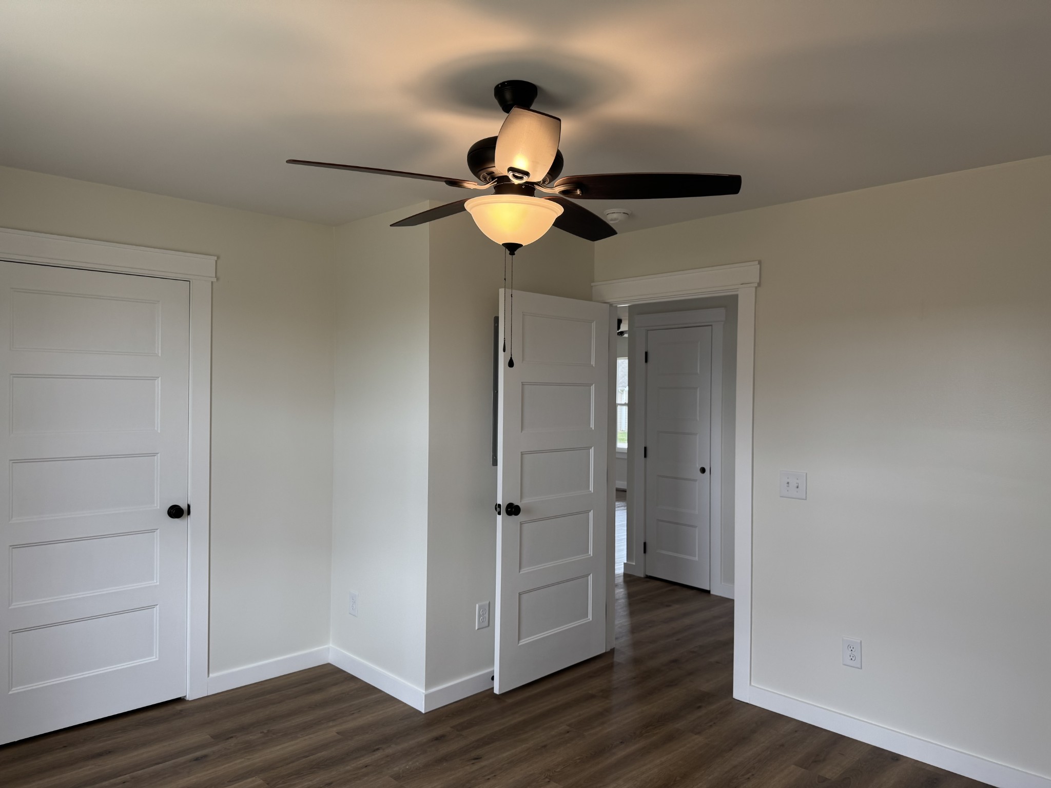 706 Courthouse View Street Lafayette, TN 37083 - Photo 18 of 27 a view of a chandelier fan and wooden floor