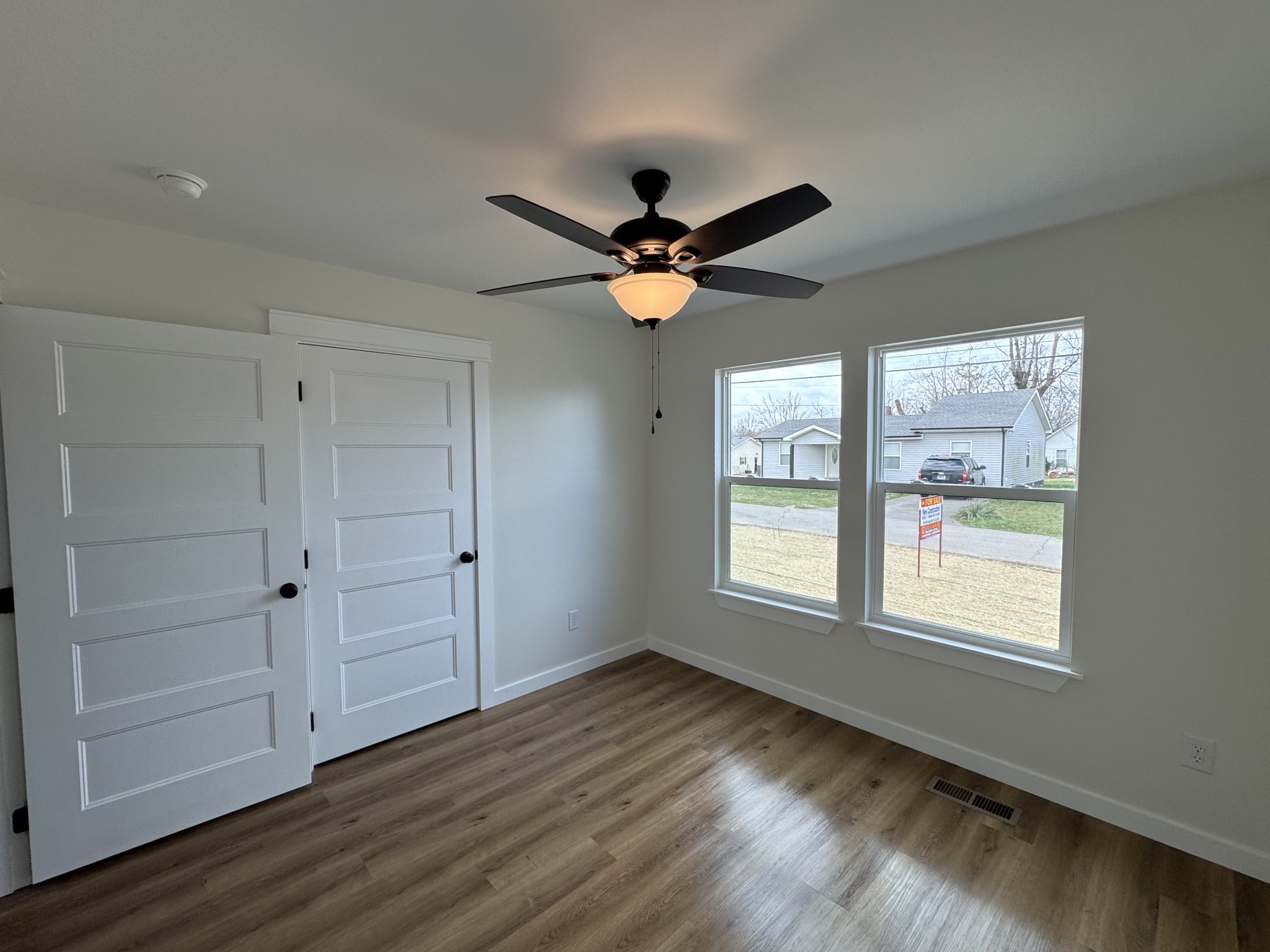 706 Courthouse View Street Lafayette, TN 37083 - Photo 20 of 27 a view of an empty room with a window and wooden floor