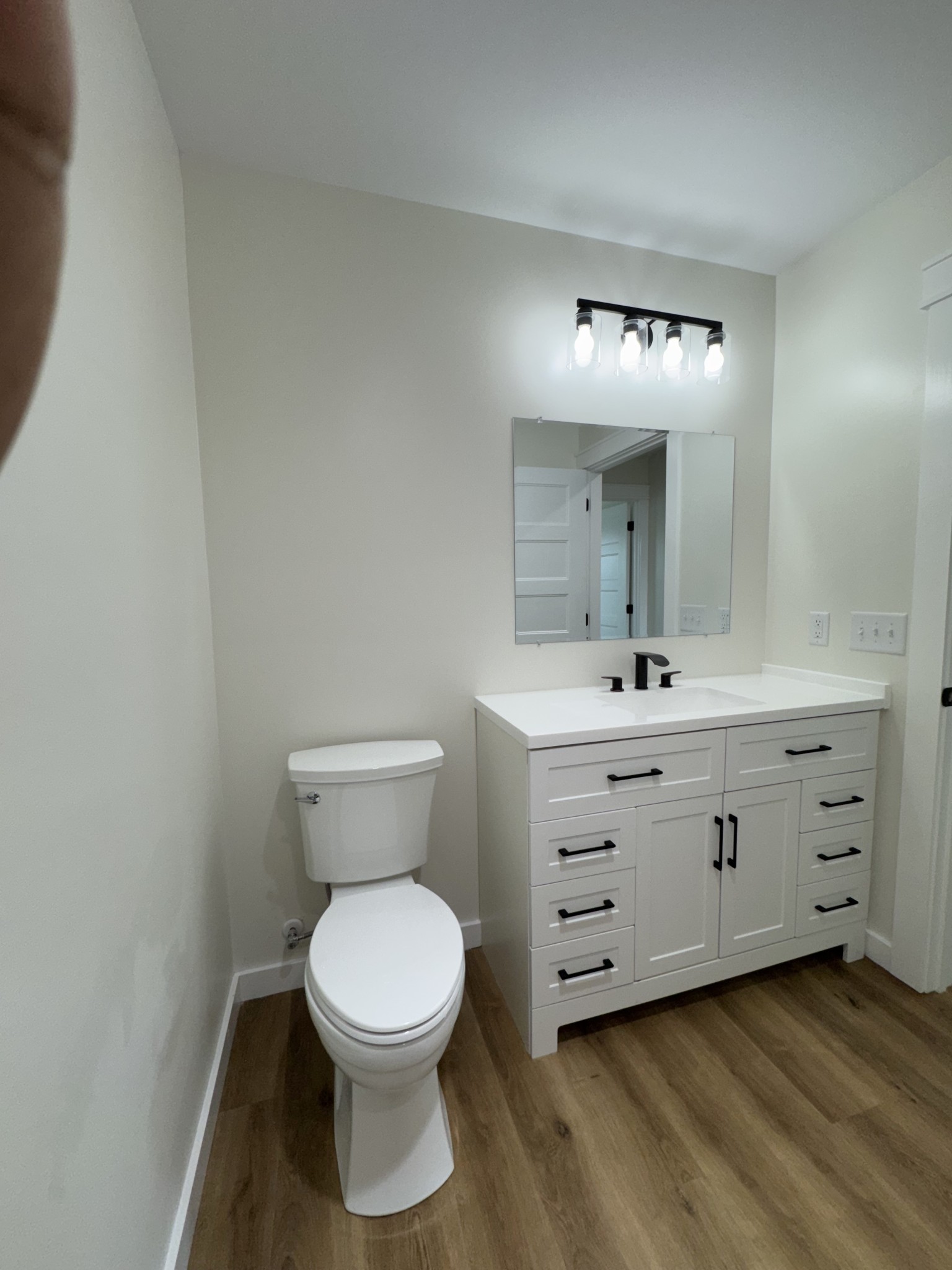 706 Courthouse View Street Lafayette, TN 37083 - Photo 22 of 27 a bathroom with a toilet sink and mirror