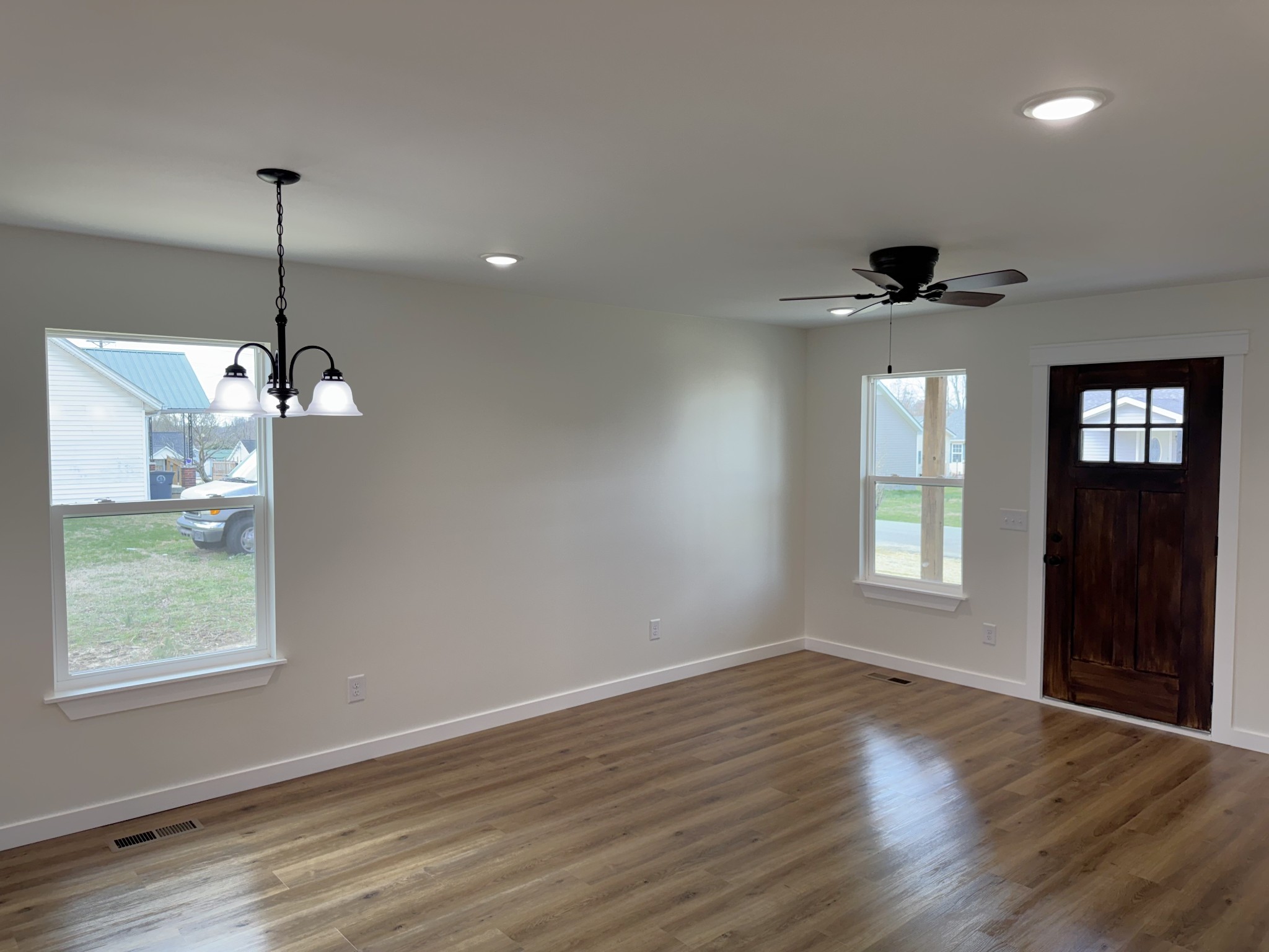 706 Courthouse View Street Lafayette, TN 37083 - Photo 5 of 27 a view of an empty room with wooden floor and a window