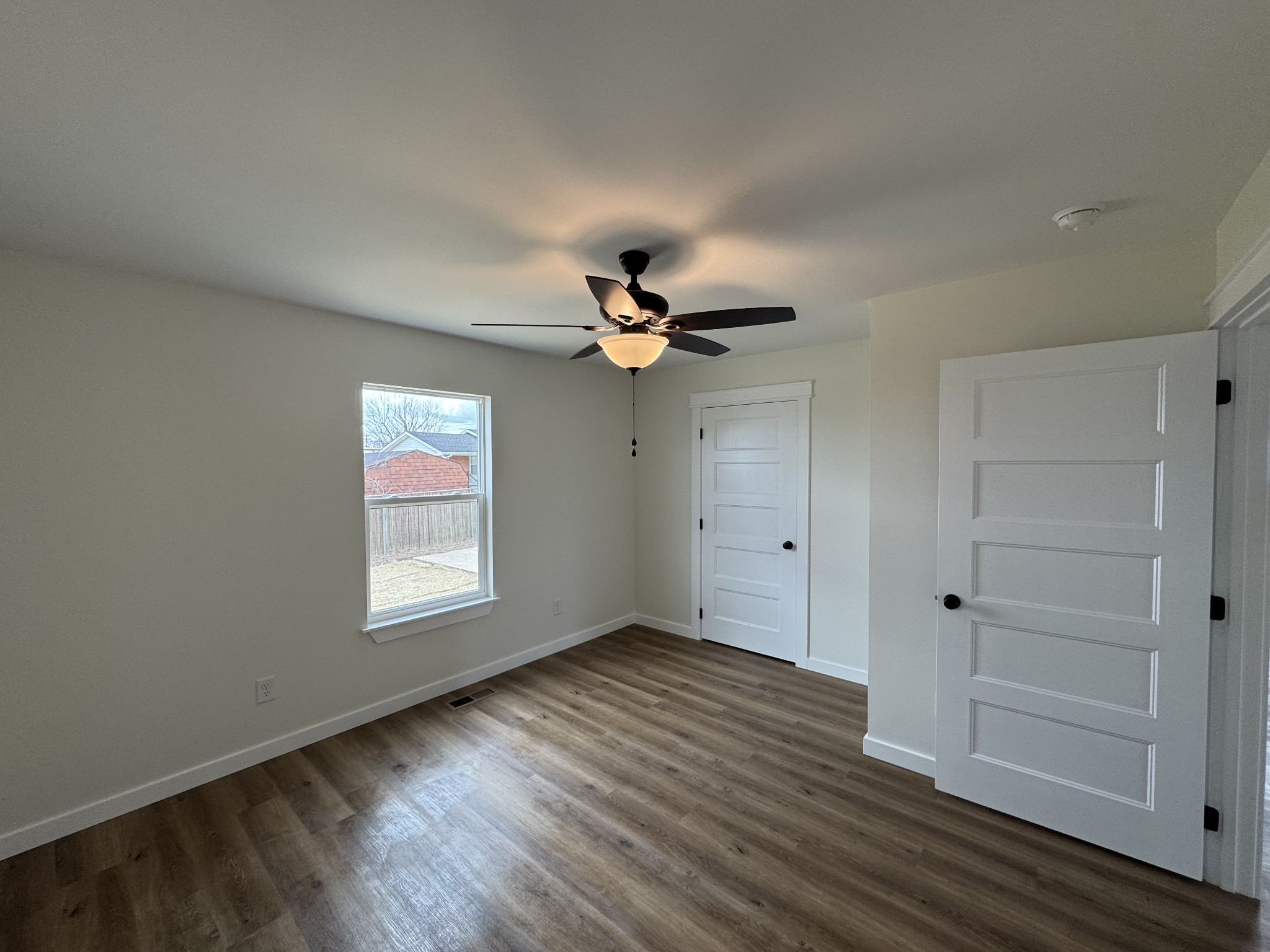 706 Courthouse View Street Lafayette, TN 37083 - Photo 9 of 27 a view of empty room with wooden floor and fan