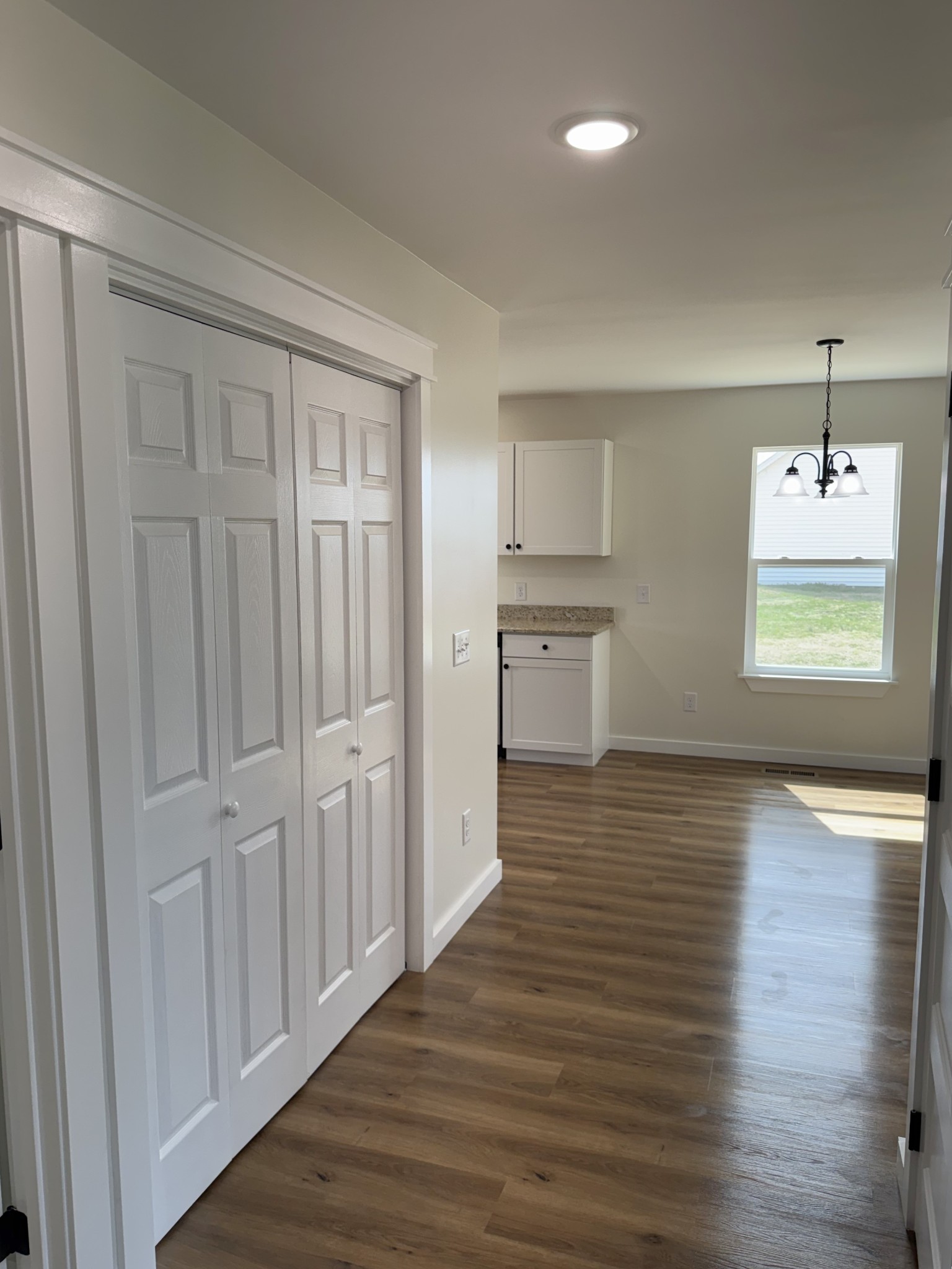 706 Courthouse View Street Lafayette, TN 37083 - Photo 10 of 27 wooden floor in an empty room with a window