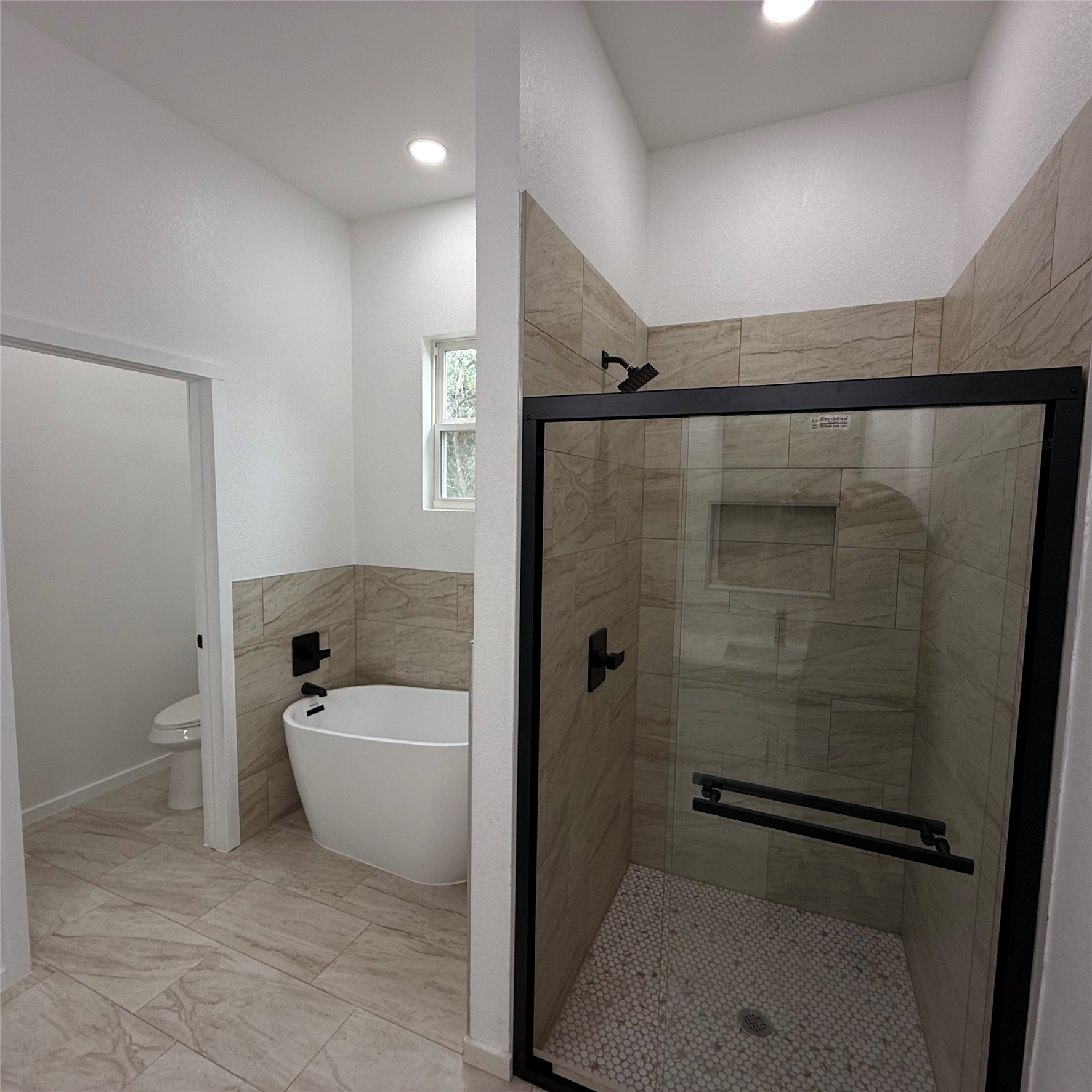 118 Crazy Cross Road Wimberley, TX 78676 - Photo 10 of 18 a bathroom with a bathtub and a shower