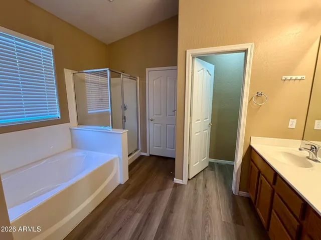 a bathroom with a sink a mirror and a bathtub