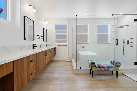 a view of kitchen with kitchen island stainless steel appliances sink stove and wooden floor