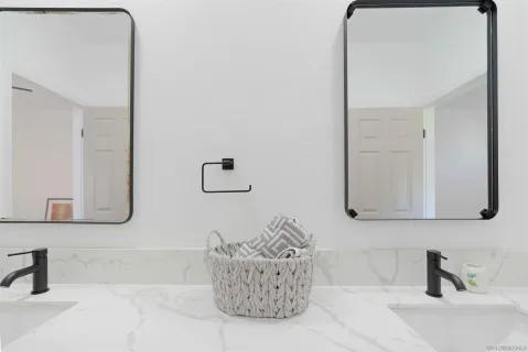 a spacious bathroom with a sink a toilet and shower