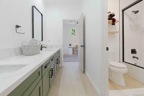 a living room with a book shelf and a book shelf