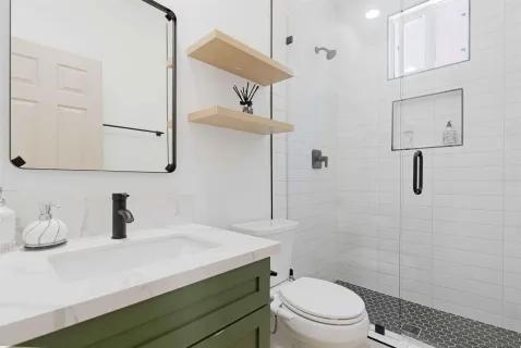 a view of a backyard with swimming pool and sitting area