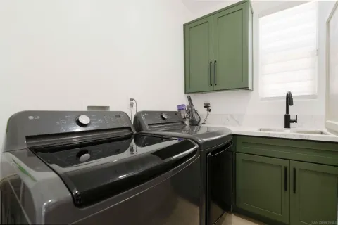 a view of a patio with table and chairs under an umbrella