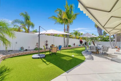 a view of a chairs and table in the patio