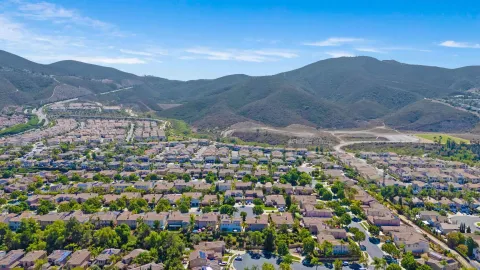 an aerial view of multiple houses with outdoor space