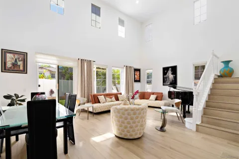 a living room with furniture and a potted plant