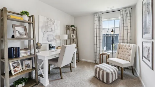 a view of a livingroom with furniture and a window