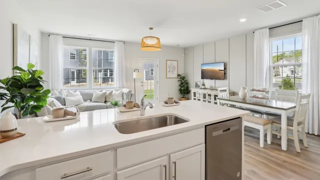 a kitchen with sink refrigerator and window