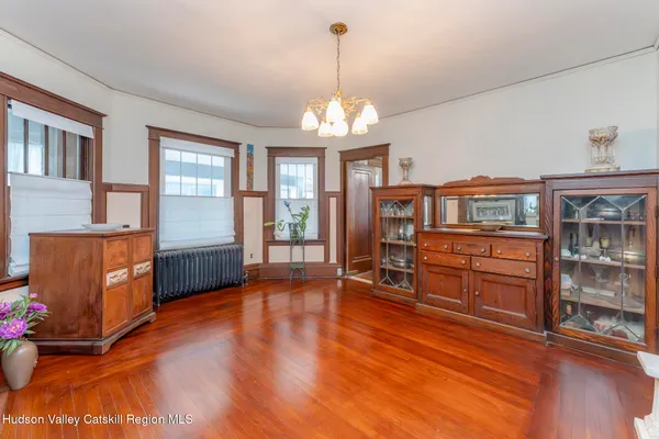 a view of a livingroom with hardwood floor and a ceiling fan