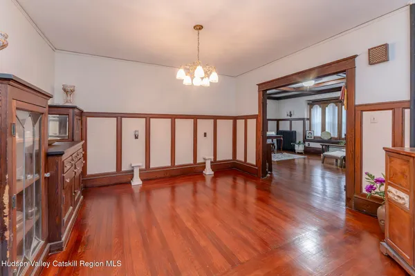 a kitchen with stainless steel appliances granite countertop a stove top oven a sink dishwasher and a microwave oven with cabinets