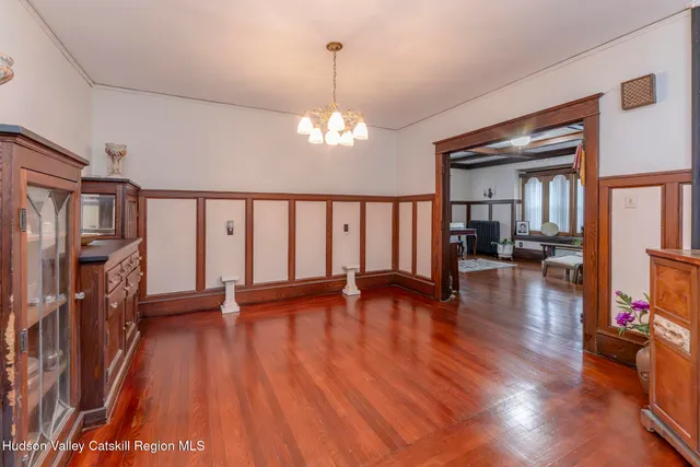 a kitchen with stainless steel appliances granite countertop a stove top oven a sink dishwasher and a microwave oven with cabinets