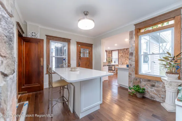 a kitchen with stainless steel appliances a refrigerator and a stove top oven