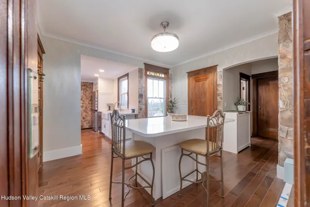 a bathroom with a toilet a sink and a window