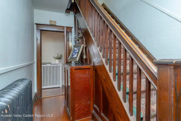 a view of a living room with furniture and windows