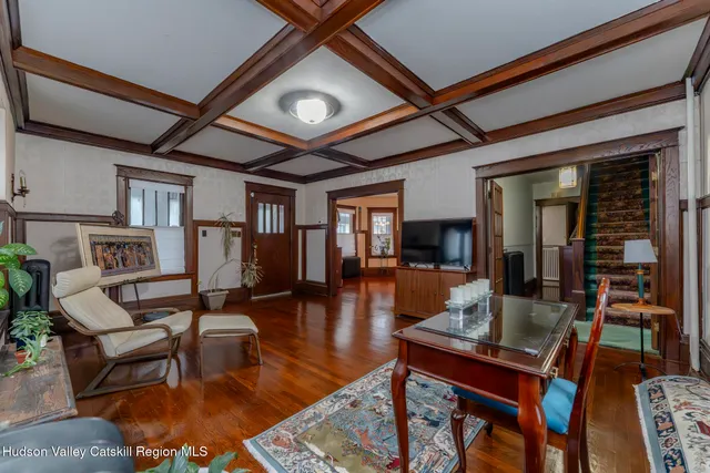 a living room with fireplace furniture and a flat screen tv