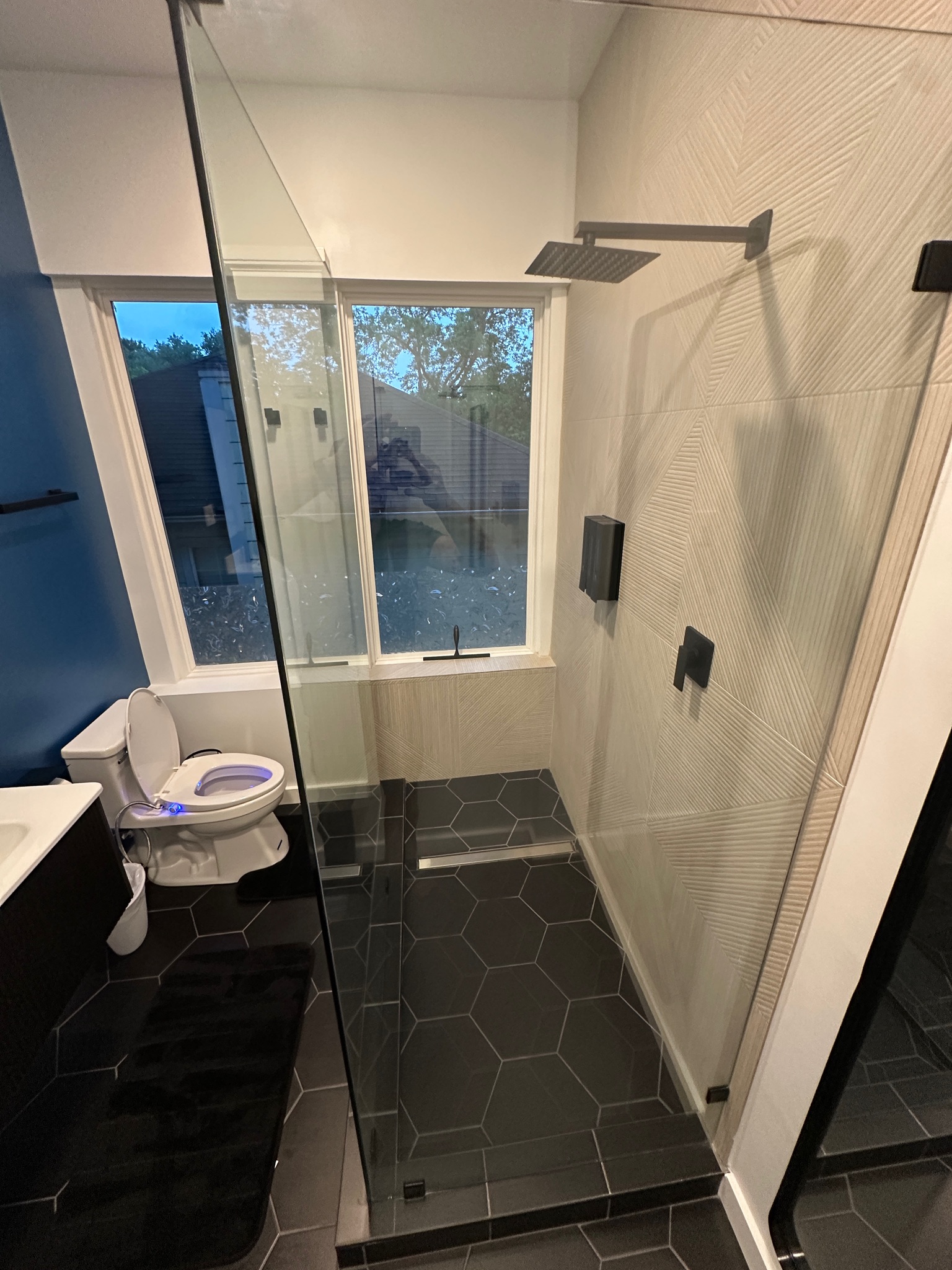 3210 Hampton Road, Unit A B C Austin, TX 78705 - Photo 12 of 42 Full bathroom featuring a stall shower, dark tile patterned flooring, and vanity
