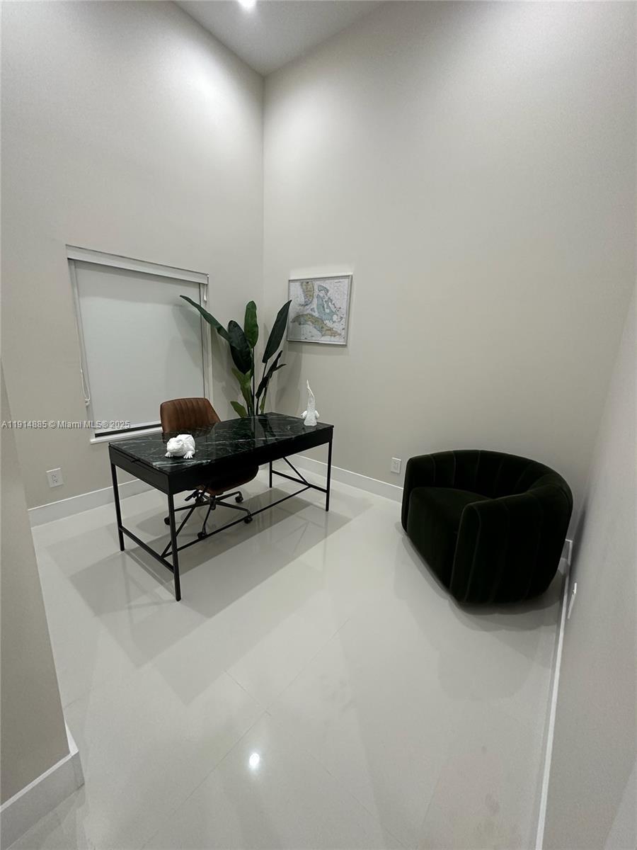 12 Adams Road Ocean Ridge, FL 33435 - Photo 15 of 24 a living room with furniture and a chair