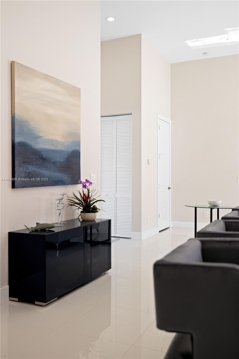 12 Adams Road Ocean Ridge, FL 33435 - Photo 17 of 24 a living room with furniture and a flat screen tv