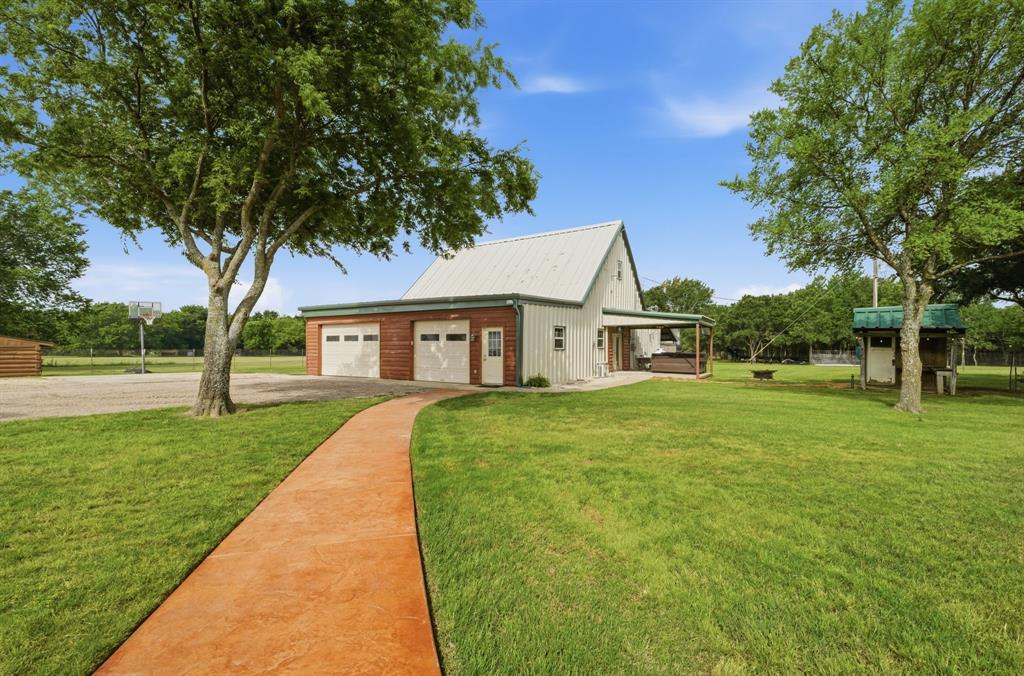 465 Emberson Ranch Road Pilot Point, TX 76258 - Photo 29 of 40 a front view of a house with yard
