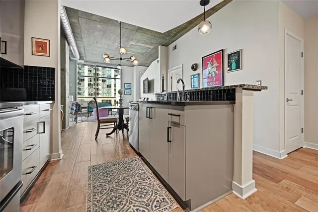 a bedroom with a bed and a night stand