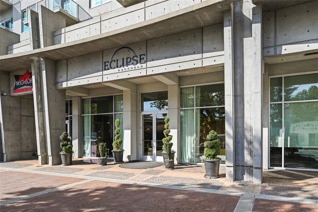 250 Pharr Road Northeast, Unit 602 Atlanta, GA 30305 - Photo 2 of 38 a front view of a building with street