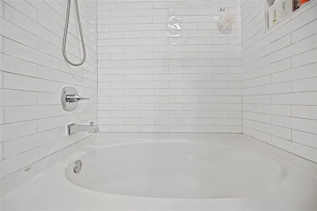 a view of a balcony with a table and chairs